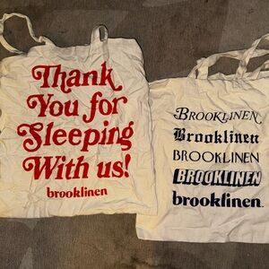 Set of 2 Brooklinen Cream Tote Bags with Red and Black Text